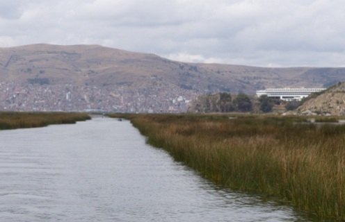 Looking back down the reed channel at our enormous hotel on the right (can they ever fill it?) with Puno behind